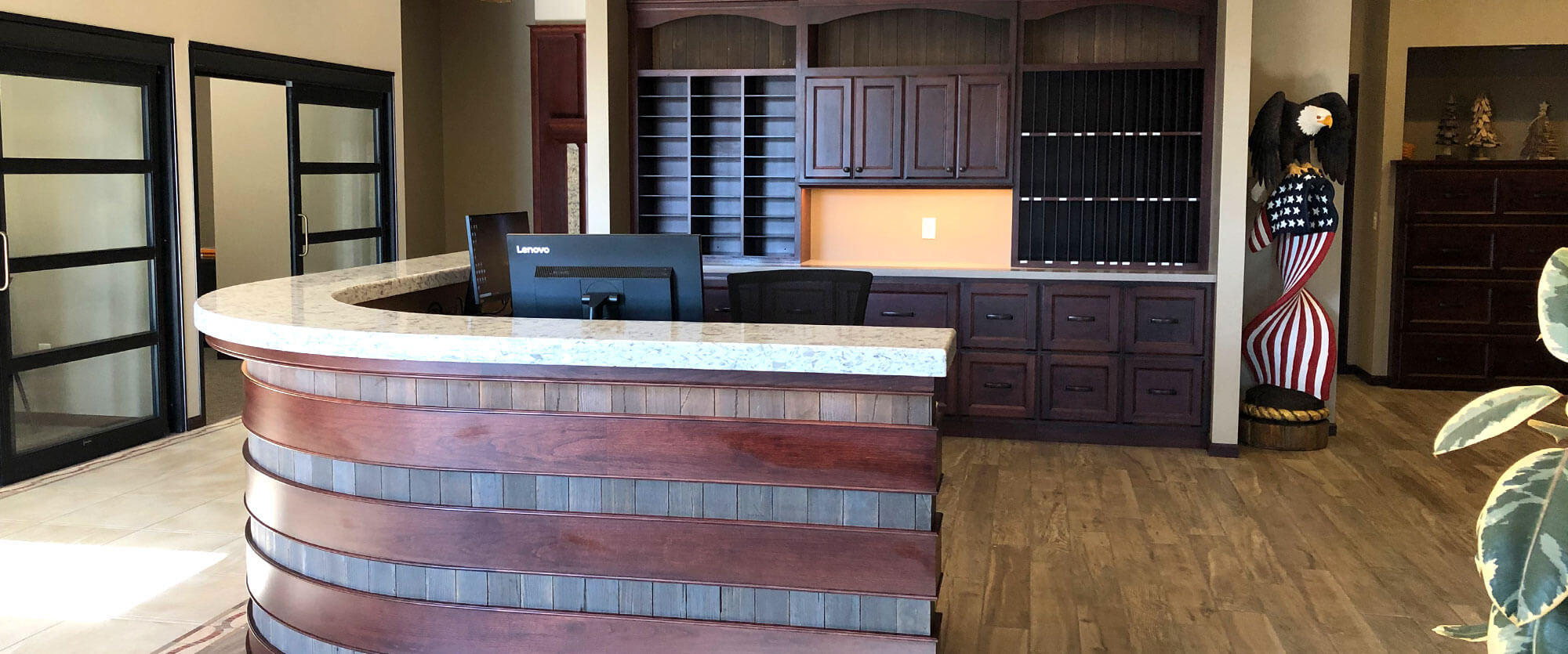 Custom wood receiption desk and storage cabinets designed, built, and installed by finewood Structures of Browerville, MN
