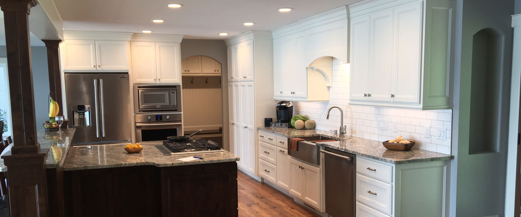 Custom kitchen cabinets made of solid wood and painted white; designed, built, and installed by finewood Structures of Browerville, MN
