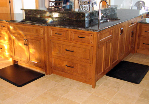 Oversized kitchen island featuring multiple tiers made of solid Cherry wood by finewood Structures of Browerville, MN