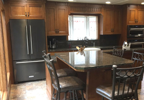 Gourmet kitchen featuring solid cabinets made from Quarter Sawn White Oak by finewood Structures of Browerville, MN